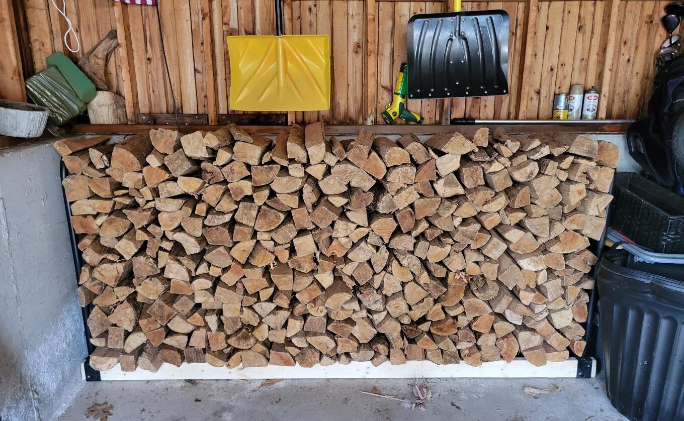Full size firewood rack stacked with firewood